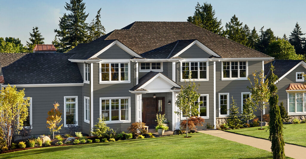 dark grey siding and white window trim